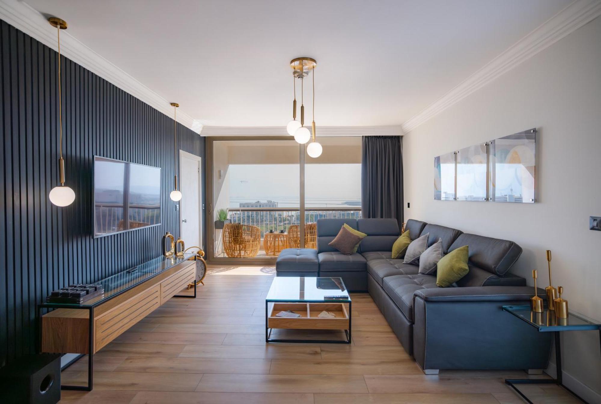 David Dead Sea Resort & Spa Én-Bokek Kültér fotó A living room in a modern apartment